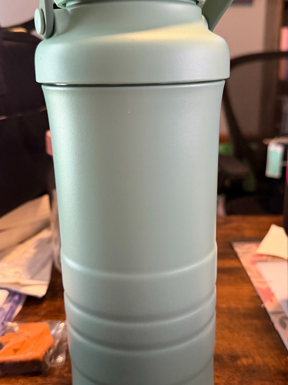Momcozy Insulated Sage Green Stainless Steel breast milk storage cooler.